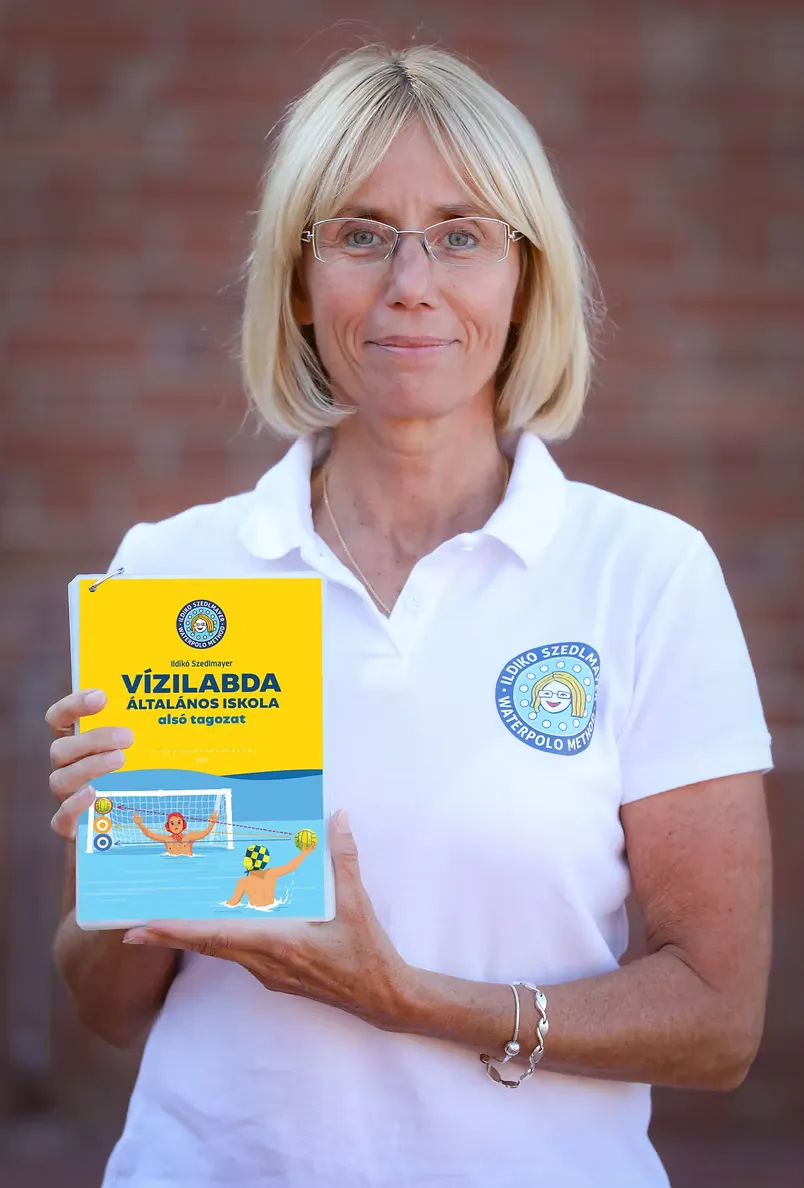 Ildikó Szedlmayer holding the Hungarian edition of her book